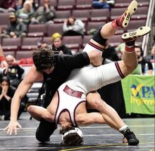 Southern Columbia's Garrett Garcia spins Huntingdon’s Andrew McMonagle during the 189-pound championship.