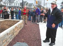 Gary Heimbach arrives at the park dedicated to him Sunday afternoon as a large crowd applauds. 
