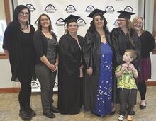 Central Susquehanna Opportunities instructors pose Tuesday with the first graduating class of their Getting Ahead in a Just-Gettin’-By World program in Columbia County. From left: Instructors Amy Misunas and Lari Thomas; graduates Kristy Wright, Tina Erb and Jennifer Lewis; and instructor Ashley Hackenberg. Lewis’ son, Gryffyn, 4, stands in front