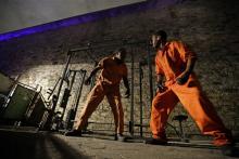 Actors portraying a zombie inmates are seen in a workout yard during the Halloween haunted house Terror Behind the Walls, at Eastern State Penitentiary in Philadelphia.
