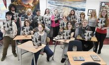 Bloomsburg High students brought back the literary magazine “Prometheus” for the first time in more than a decade. Holding copies are, from left, seated: Will Phillips, Emily Schultz, Toby Livingstone, Olivia Whitmire and Adrianna Howell. Standing are Christopher Pepe, Miguel Lopez, Adviser Michelle Hintz, Jason Rivera, Cassie McGinley, Lea Albercht, Katie Studebaker, Madison Haydt, Jylian Bohner and Emma Whitmire.