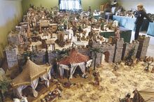 Angels stand on the wall above the gates to Bethlehem in John Capozzelli’s extensive Christmas story layout on Saturday. It’s on the second floor of the garage at his Salem Township home. Moving among the scenes is his grandson Luke Frantz, 8.