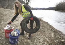 Tanya Nebroski stands at the confluence of Fishing Creek and the Susquehanna River in Bloomsburg with some of the trash she collected earlier on Thursday. Her informal group of creek cleaners and the Columbia-Montour Visitors Bureau are holding a pickup-trash contest with the chance to win prizes. 