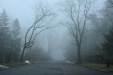 A jogger fades into the fog in Pottsville, Pa