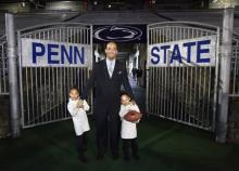 James Franklin poses with his daughters Addy, 5, and Shola, 6, after he was officially introduced as the new Penn State football coach during a news conference, Saturday, Jan. 11, 2014, in State College, Pa. Franklin was formerly the head coach at Vanderbilt University. He replaces Bill O'Brien who left Penn State after two seasons to become head coach of the Houston Texans.