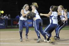 From left, Central Columbia's Paige Siegrist, Marissa Shelhamer, Kimmy Hollister and Allison McCracken celebrate the Blue Jays’ win over Bald Eagle Area in the pitcher’s circle on Friday at Penn State University.