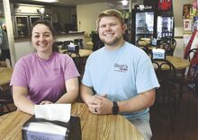 Mackenzie and Dustin Peters are the new owners of Steph’s Subs in Bloomsburg. They’re shown Tuesday at one of the tables in the Bloomsburg business. Founder Steph Severn officially retired when the sale was finalized Tuesday morning