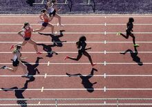 Heading down the track during the 100 meter run are, from left, Mifflinburg’s Calleigh Hoy, Danville’s Lauren Law and Hannah Hafer, Mifflinburg’s Ally Shaffer, Makayla Fogle and Makenna Fogle Tuesday afternoon in Danville.