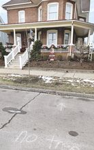 A new tree is planted in front of 325 W. Fifth St. in Bloomsburg on Wednesday. The words “No Tree” are spray painted on the street in front of the home. (Click for full photo.)