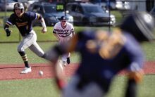 Berwick's Nick Uram, center, fields the ball off the bat of Montoursville’s Jordan Wilson, right, as Royce Bowes heads toward third during the second inning. Uram threw the ball to second and Berwick turned the double play to end the frame Monday afternoon in Berwick.