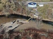 A crew is working for Veolia in conjunction with Hemlock Township to remove gravel bars and accumulated material around the water plant intake in Fishing Creek on Wednesday.