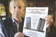 Dick Powlus holds an illustration showing what the Berwick-Nescopeck Vietnam Veterans Memorial will look like after planned repairs are made.