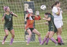 From left, Vo-Tech’s Arianna Sheatler and goalkeeper Lacey Zimmerman react as a corner kick crosses over VoTech’s Piper Karcher and Weatherly’s McKenna Gerhard during the first half of Tuesday afternoon’s game at VoTech. Vo-Tech got its first win of the year, 4-3.
