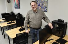 Ammon Young, director of the Bloomsburg Public Library, stands in the technology lab last week. The library will soon have a worker assigned to increase the computer literacy of older or less tech-savvy patrons.